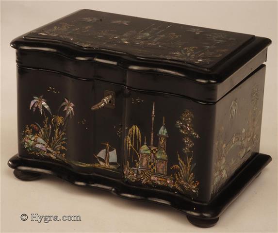 Papier mch two compartment tea caddy  exquisitely decorated with oriental scenes in mother of pearl and gilding, the inside with supplementary lids.  The lock stamped with "VR" for Victoria Regina. This is one of the few examples of this decorative style to survive. It points to the work of Alsager, first employed by Jennens and Bettridge and later in his own company Alsager & Neville. He was one of the principle exponents of chinoiserie decoration.  Circa 1845.   Enlarge Picture